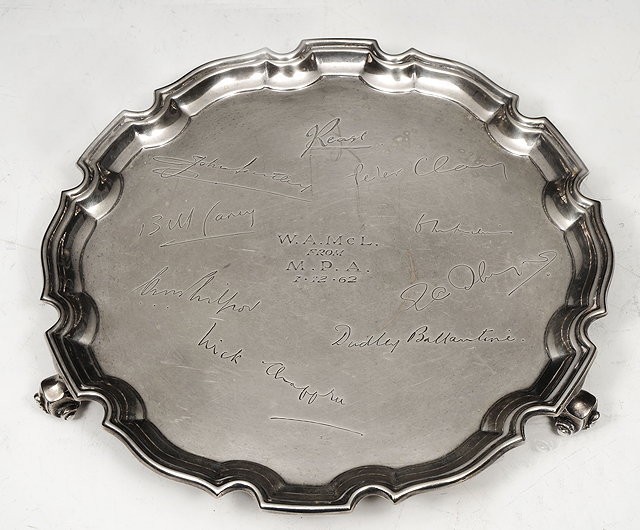 Appraisal: A SMALL SILVER SALVER with raised pie-crust border and scroll