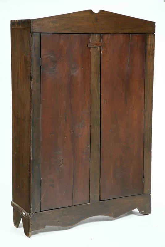 Appraisal: CUPBOARD Walnut having a brown stain shaped crest and apron