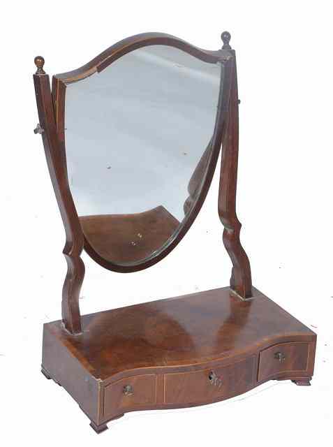 Appraisal: A TH CENTURY MAHOGANY SHIELD SHAPED DRESSING TABLE MIRROR the