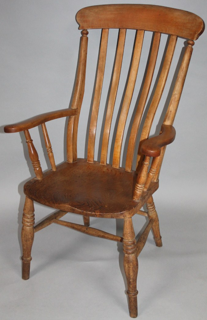 Appraisal: A late thC stripped ash and elm grandfather chair with