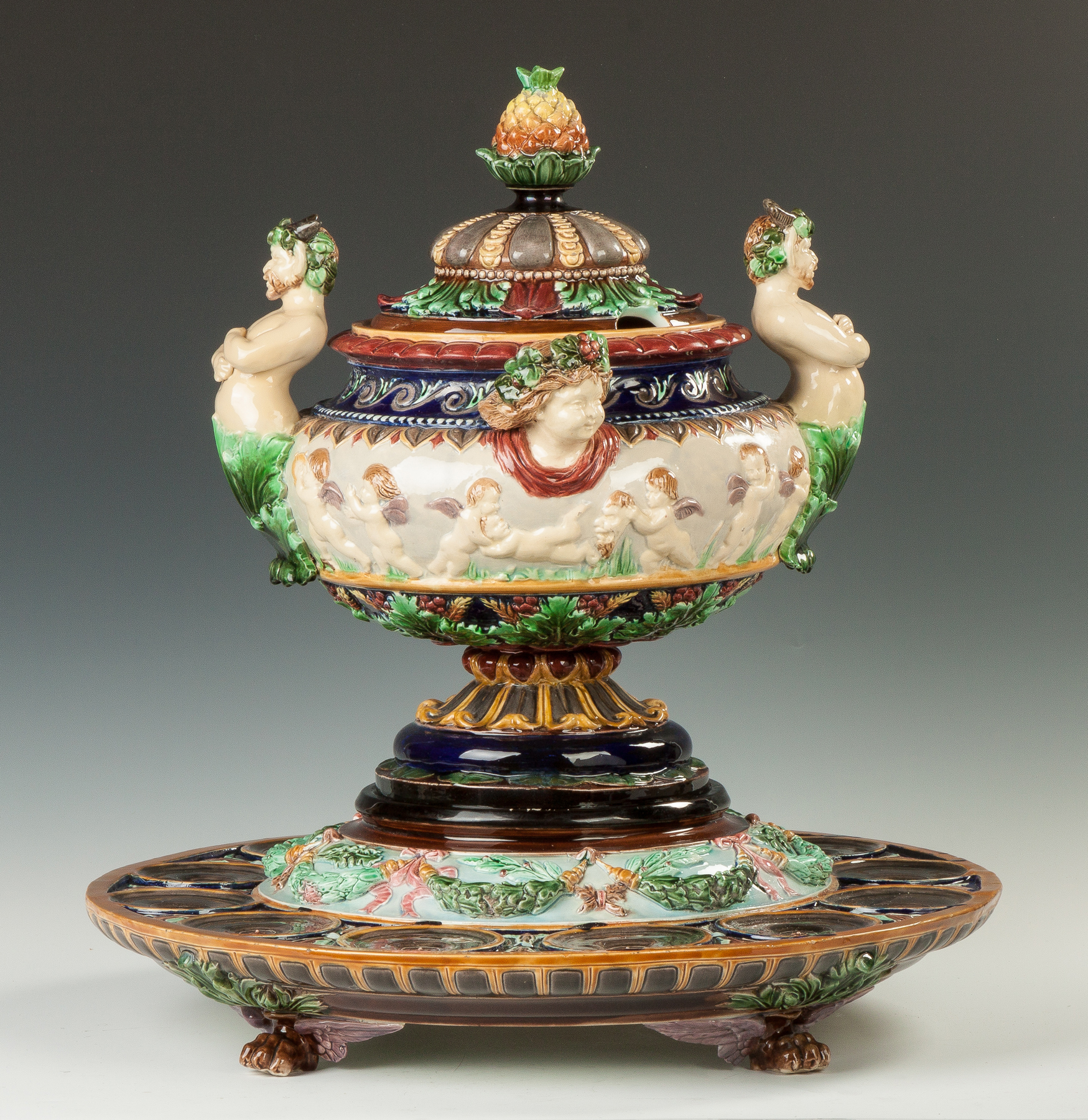 Appraisal: Monumental Majolica Punch Bowl and Stand th cent With cherubs