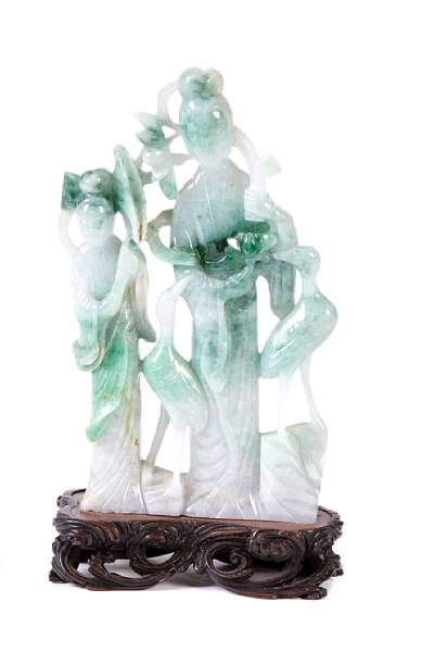 Appraisal: A jadeite carving of figures and cranes height in width