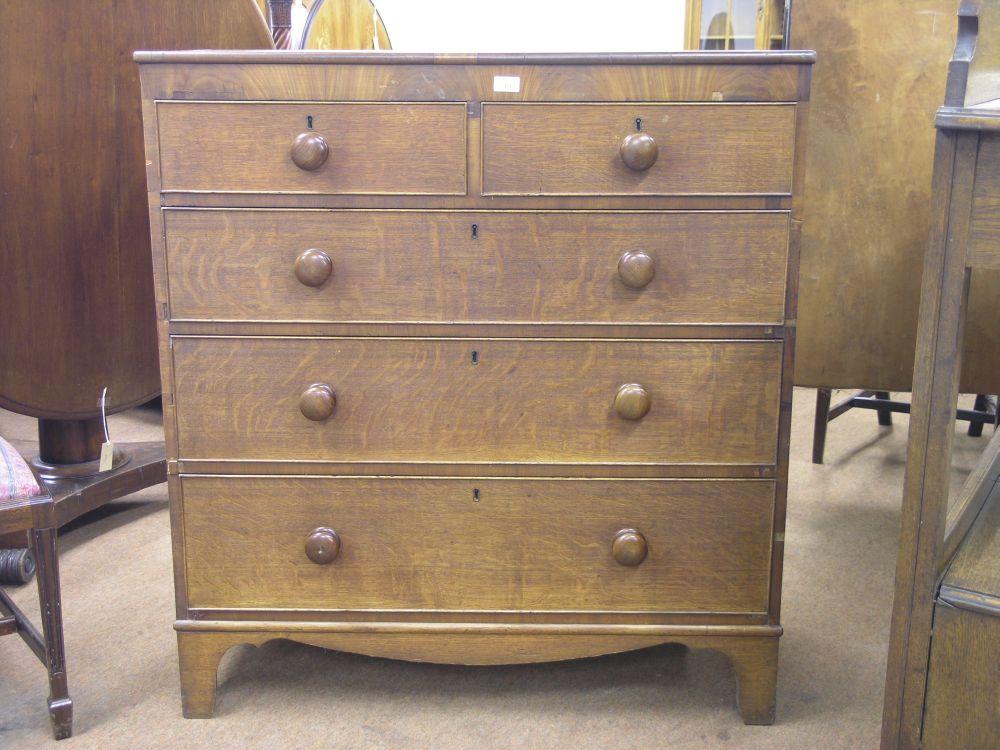 Appraisal: A Victorian oak and mahogany cross-banded chest two short and