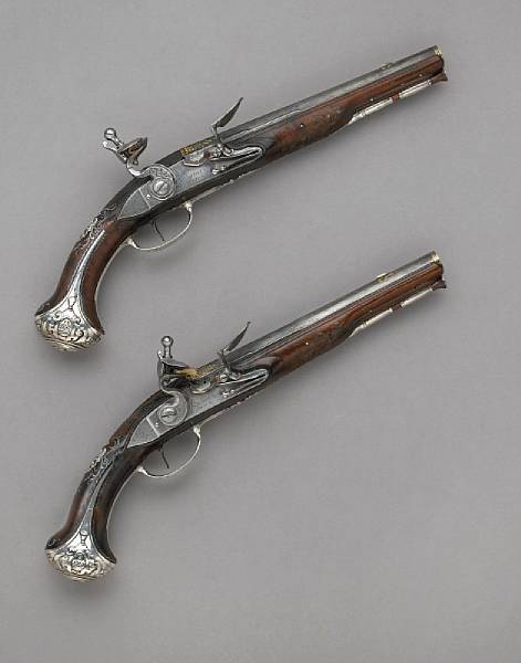 Appraisal: A pair of silver-mounted French flintlock pistols bearing the arms