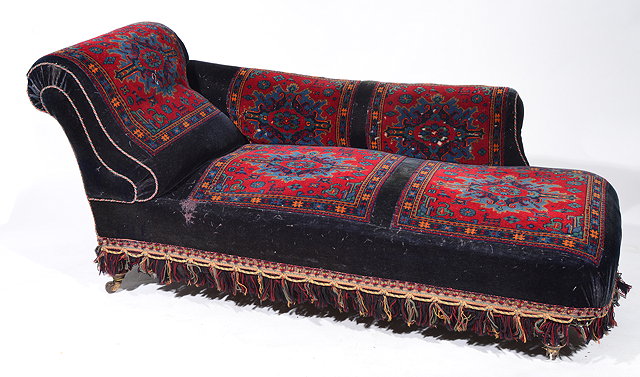 Appraisal: A VICTORIAN CARPET COVERED CHAISE LONGUE with shaped back and