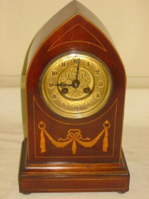 Appraisal: AN EDWARDIAN MANTEL CLOCK the French striking movement with two