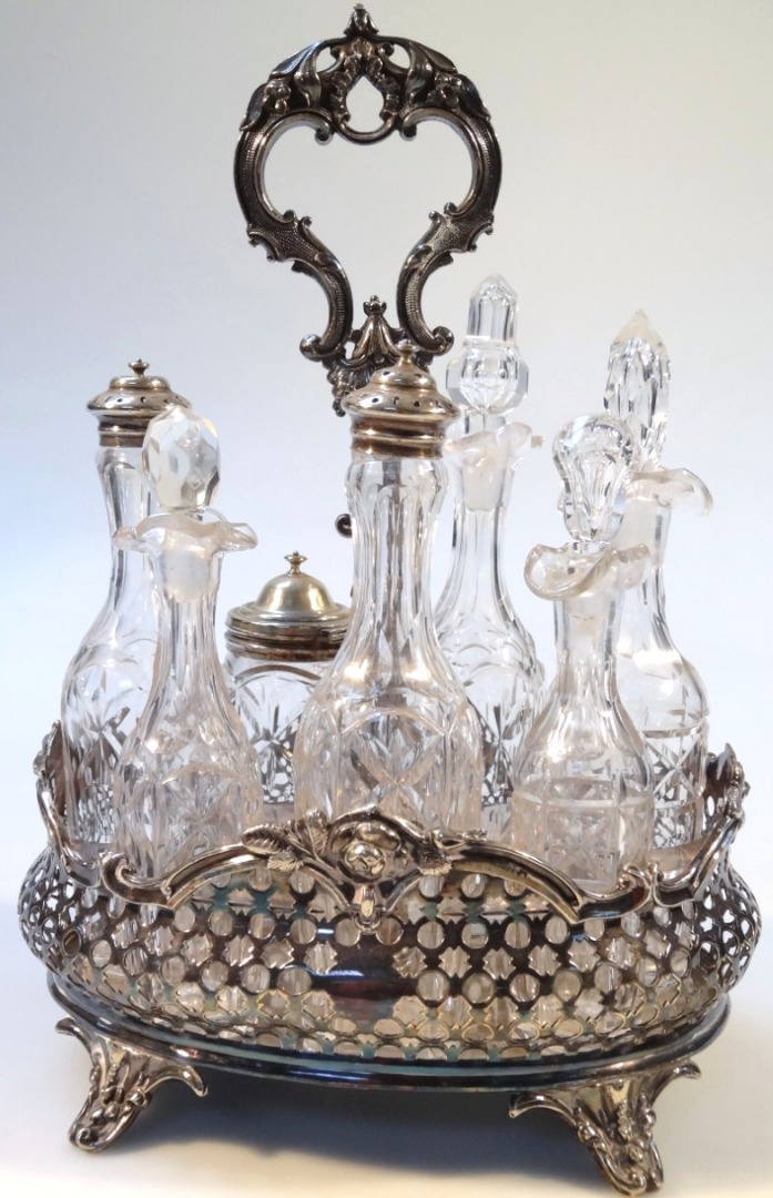 Appraisal: An early thC glass and silver plated bottle cruet set