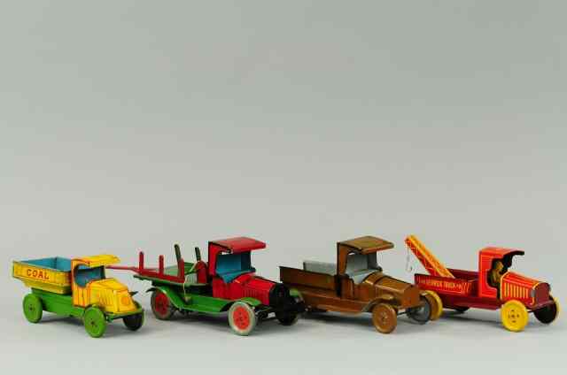 Appraisal: TIN WORK VEHICLES All tin lithographed trucks three Chein trucks