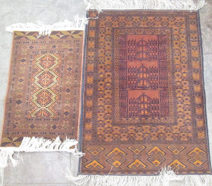 Appraisal: TWO SIMILAR AFGHAN TRIBAL AREA RUGS ' x ' and