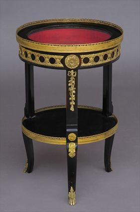 Appraisal: LOUIS XVI-STYLE GILT-METAL-MOUNTED BLACK LACQUER VITRINE TABLE The circular galleried