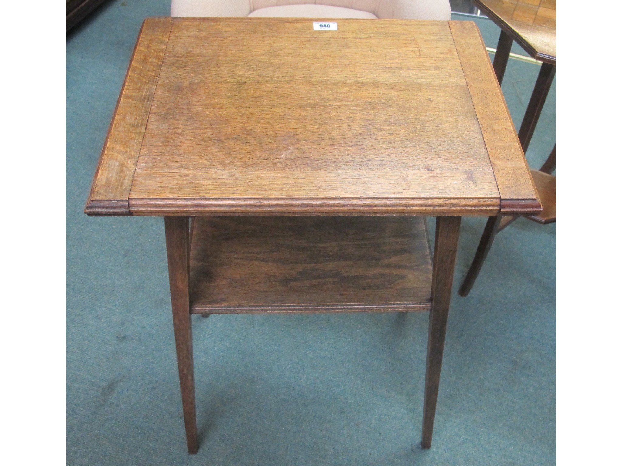 Appraisal: Edwardian oak fold over two tier card table and a