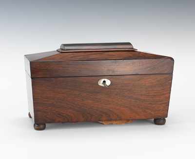 Appraisal: A Regency Tea Caddy Sarcophagus form rosewood veneered hinged lid