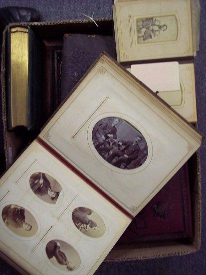 Appraisal: A Victorian photograph album containing various photographic portraits with brass