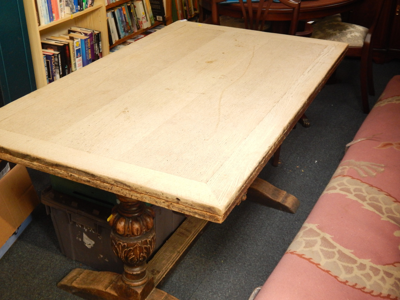 Appraisal: An oak refectory style draw leaf dining table with carved