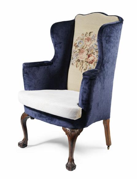 Appraisal: GEORGE II MAHOGANY AND UPHOLSTERED WING ARMCHAIR with padded outswept