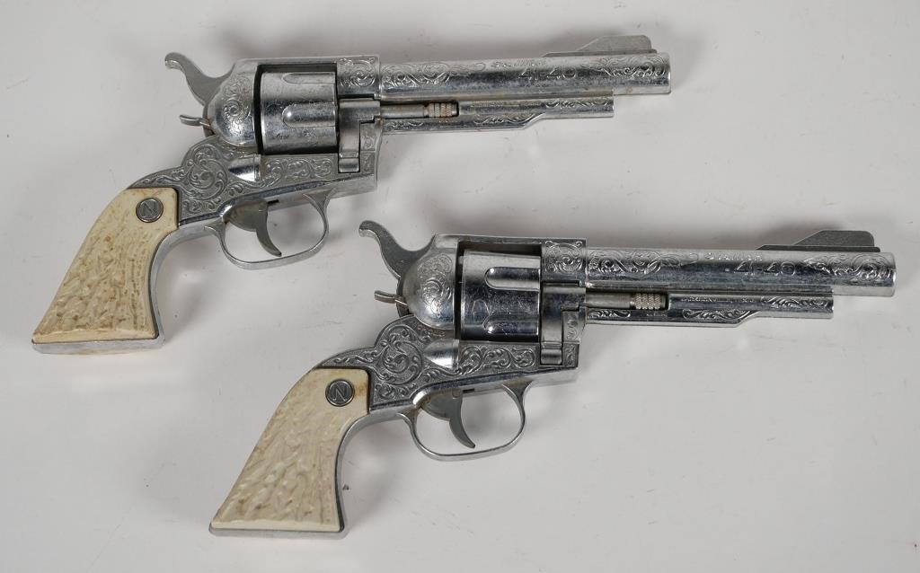 Appraisal: PAIR OF NICHOLS TOY CAP GUNS Two Nichols Stallion -