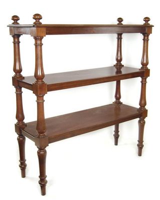 Appraisal: An early Victorian mahogany three tier buffet on turned baluster