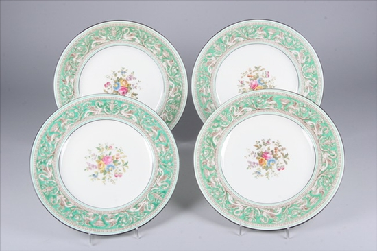 Appraisal: EIGHT WEDGWOOD DINNER PLATES Green border centered with floral spray