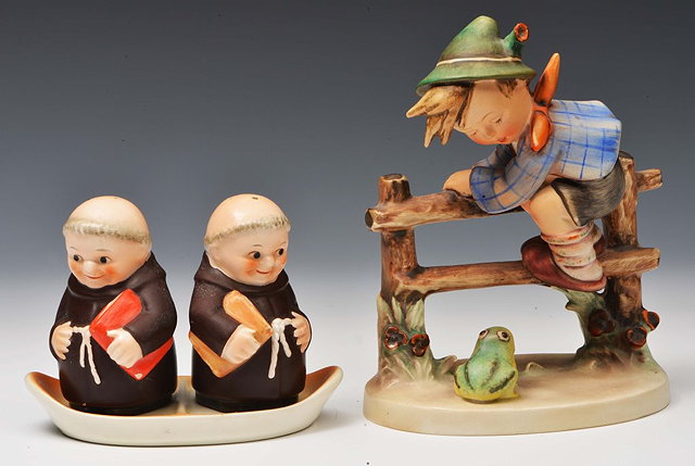 Appraisal: A GOEBEL HUMMEL FIGURE OF A BOY climbing a picket