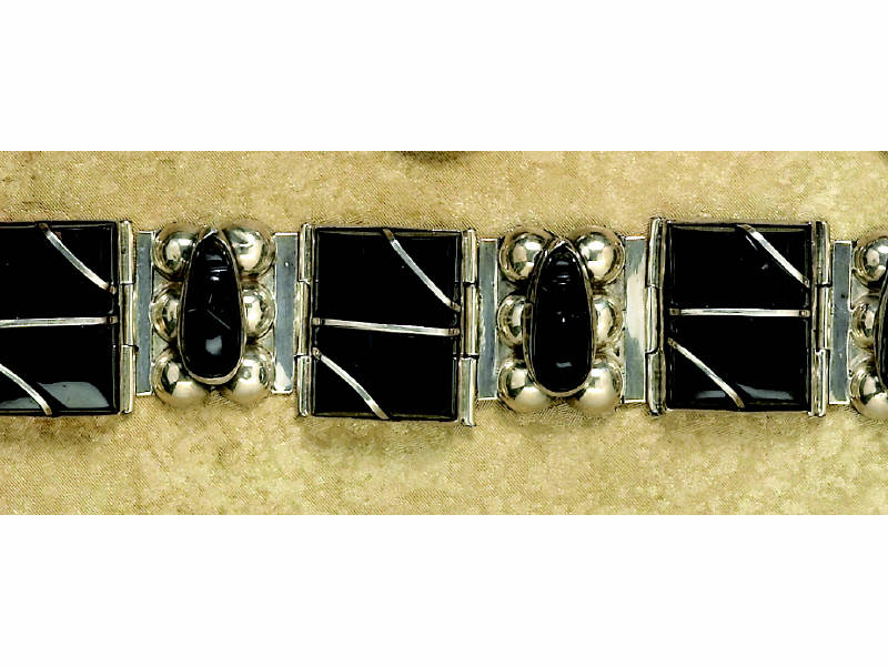 Appraisal: MEXICAN SILVER BRACELET With pear shaped bezel set carved onyx