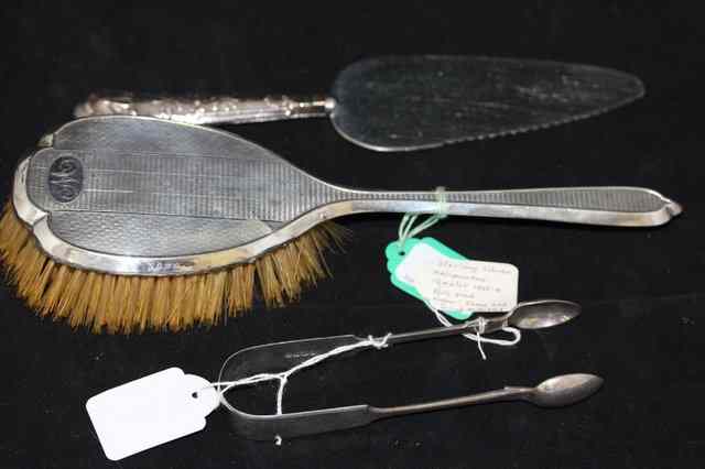 Appraisal: A SILVER BACKED HAIRBRUSH together with a pair of silver