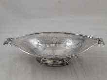 Appraisal: An open two handled silver dish on foot with reeded