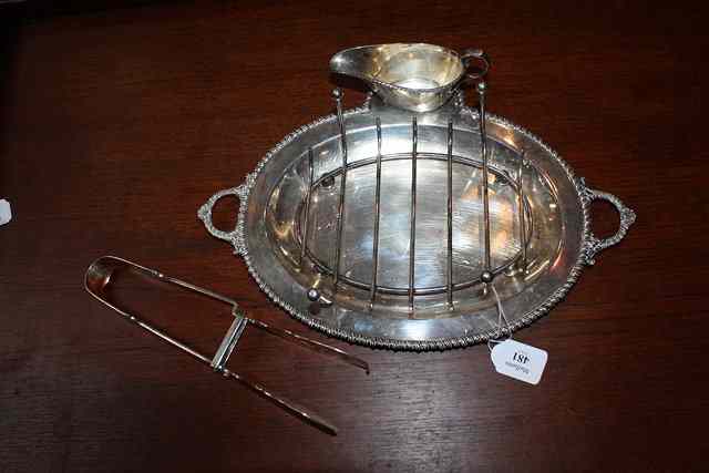 Appraisal: A SILVER PLATED OVAL ASPARAGUS DISH with cast handles gadrooned