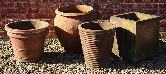 Appraisal: AN OLD TERRACOTTA OVOID PLANTER with flaring rim cm diameter