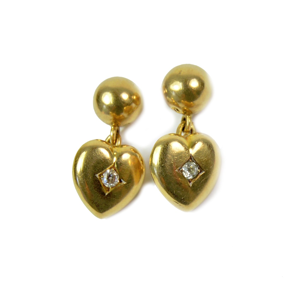 Appraisal: A pair of gold and diamond cufflinks formed as a