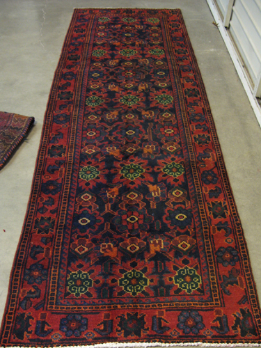 Appraisal: PERSIAN AFSHAR HALL CARPET overall stylized floral design on dark