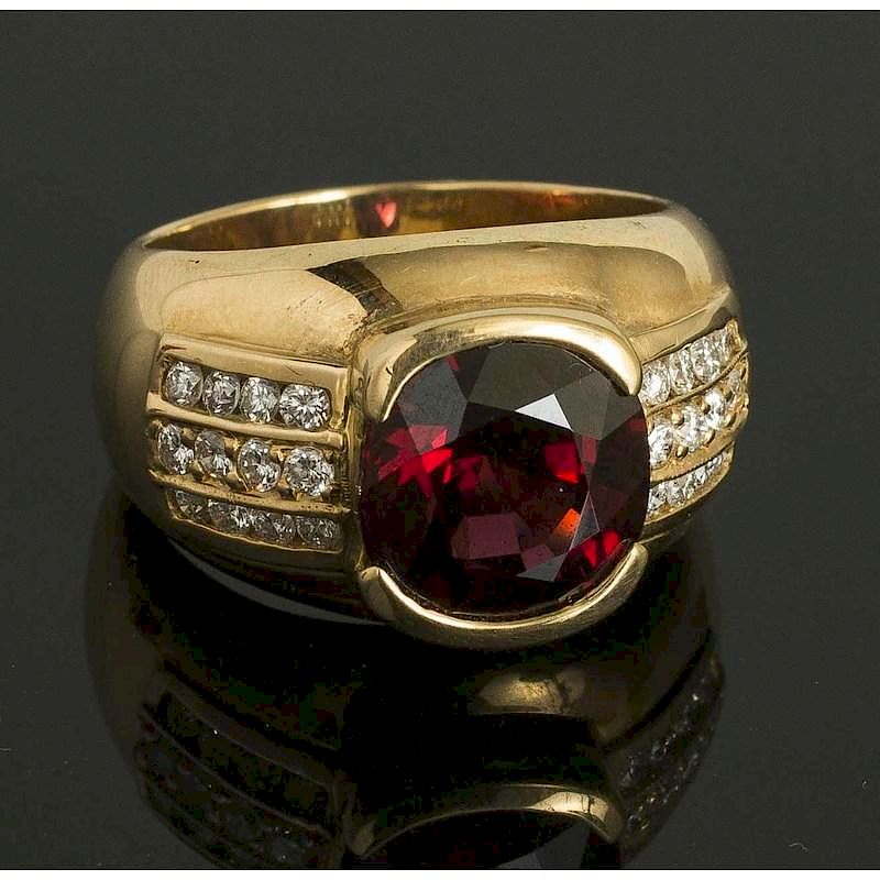 Appraisal: Garnet Diamond Gold RIng k yellow gold ring containing an