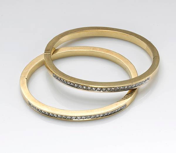 Appraisal: A pair of diamond and k gold bangle braclets estimated