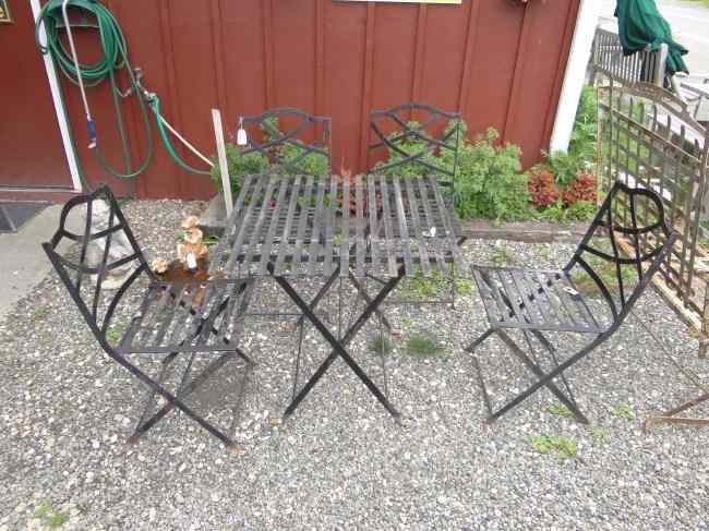 Appraisal: Folding patio set including slatted top table and four chairs