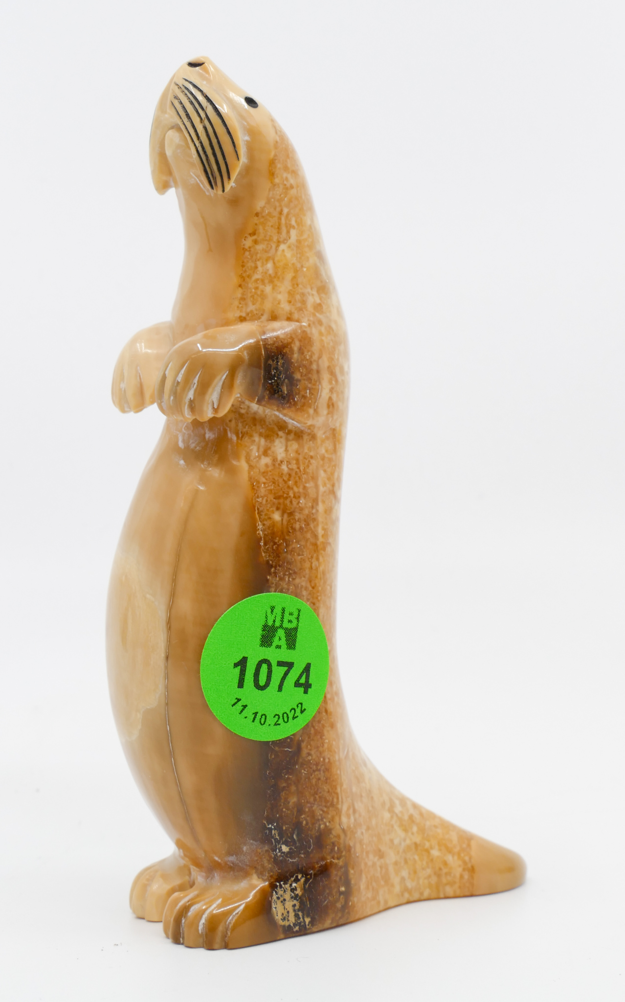 Appraisal: Eddie Lynd Inuit Scrimshawed Sea Otter Sculpture ''