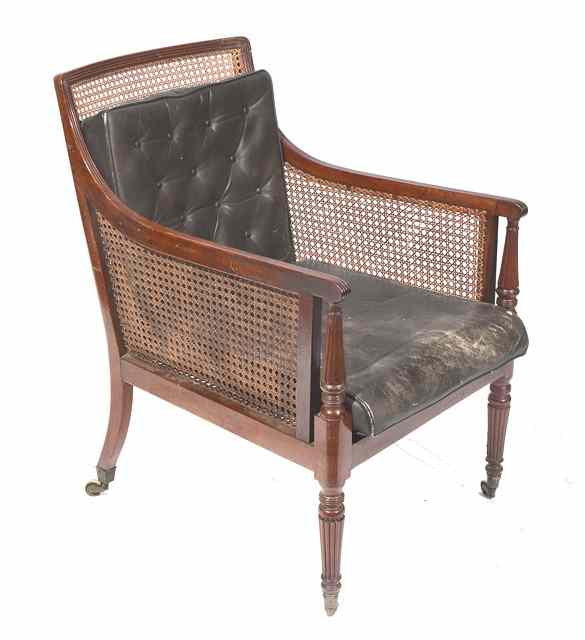 Appraisal: A GEORGE IV STYLE MAHOGANY LIBRARY CHAIR with cane back