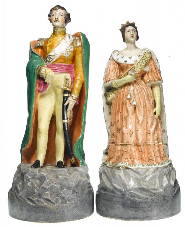 Appraisal: A PAIR OF STAFFORDSHIRE PORCELANEOUS PORTRAIT FIGURES OF QUEEN VICTORIA