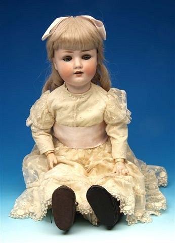 Appraisal: A German girl doll the bisque head with blue sleeping