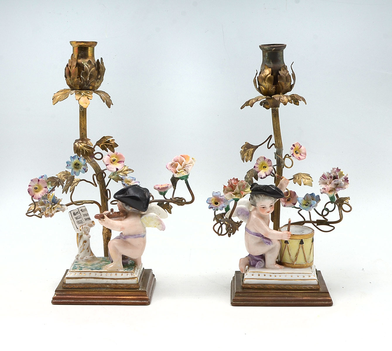 Appraisal: PAIR OF FRENCH FIGURAL BRONZE PORCELAIN CANDLESTICKS French floriform candlesticks