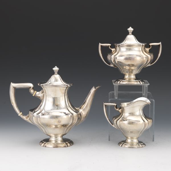 Appraisal: INTERNATIONAL STERLING SILVER THREE-PIECE TEA SERVICE Ovoid fluted form with