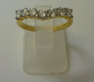 Appraisal: A DIAMOND HALF ETERNITY RING of mild wishbone form the