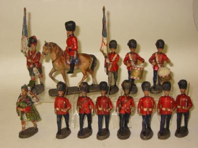 Appraisal: Fourteen Elastolin figures comprising one mounted Guards Officer seven riflemen