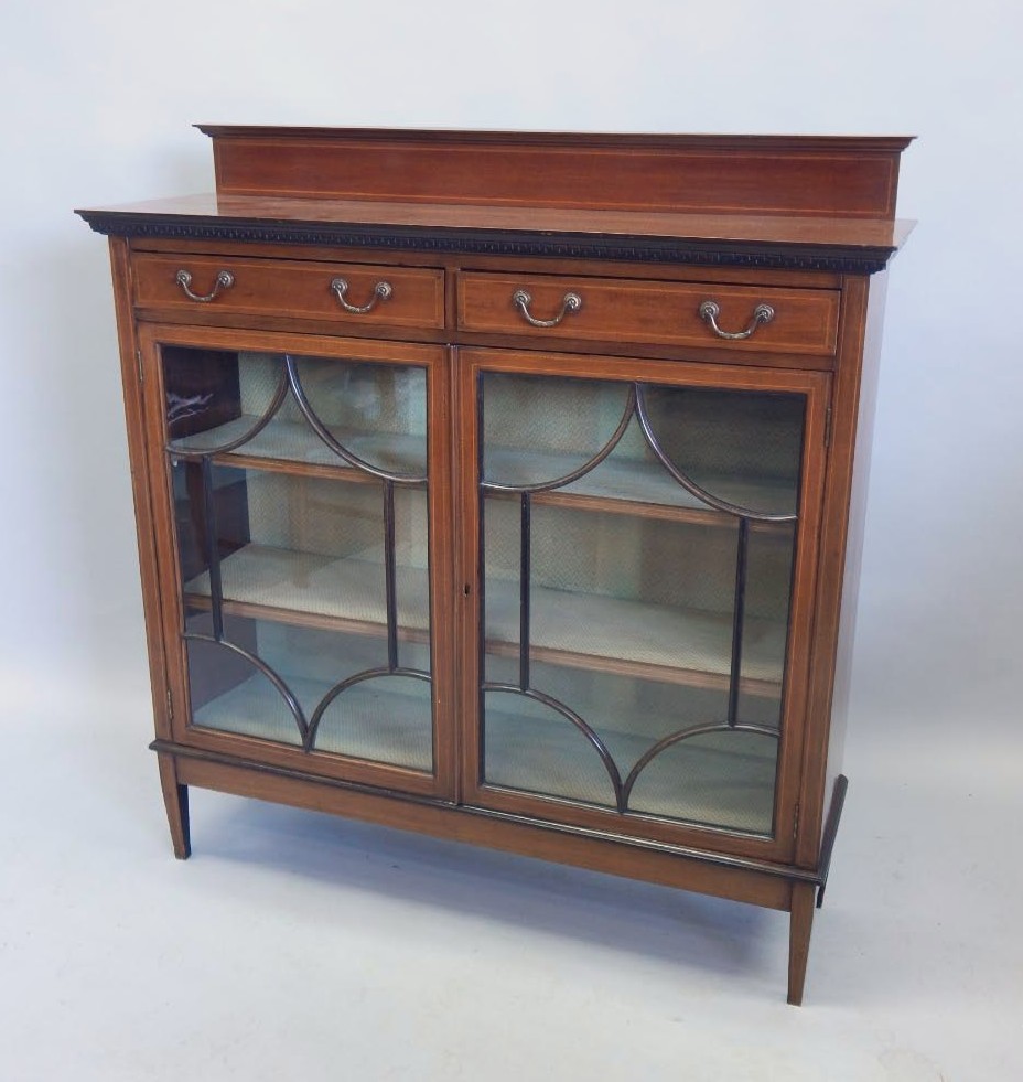 Appraisal: An Edwardian mahogany and chequer banded display cabinet with a