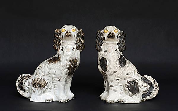 Appraisal: A pair of Staffordshire black and white spaniels th century