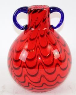 Appraisal: Red swirl art glass vase with double handle Red swirl