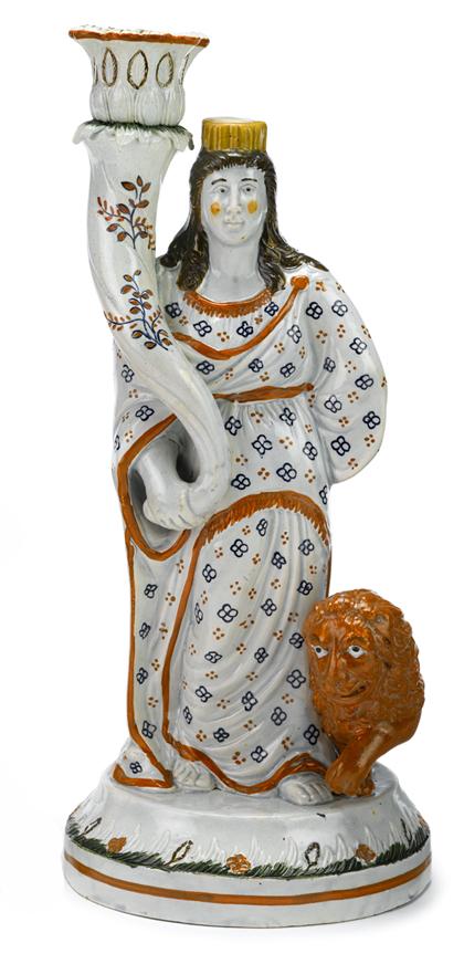 Appraisal: Staffordshire polychrome figural candlestickengland early th century