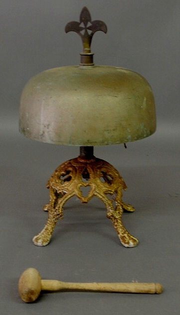 Appraisal: Cast iron and brass dinner bell with fleur-de-lis finial found