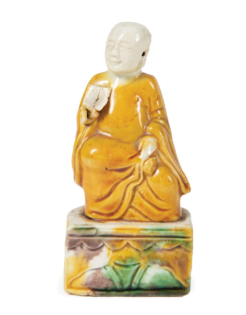 Appraisal: Chinese Sancai Glazed Porcelain Figure of a Monk Kangxi Period