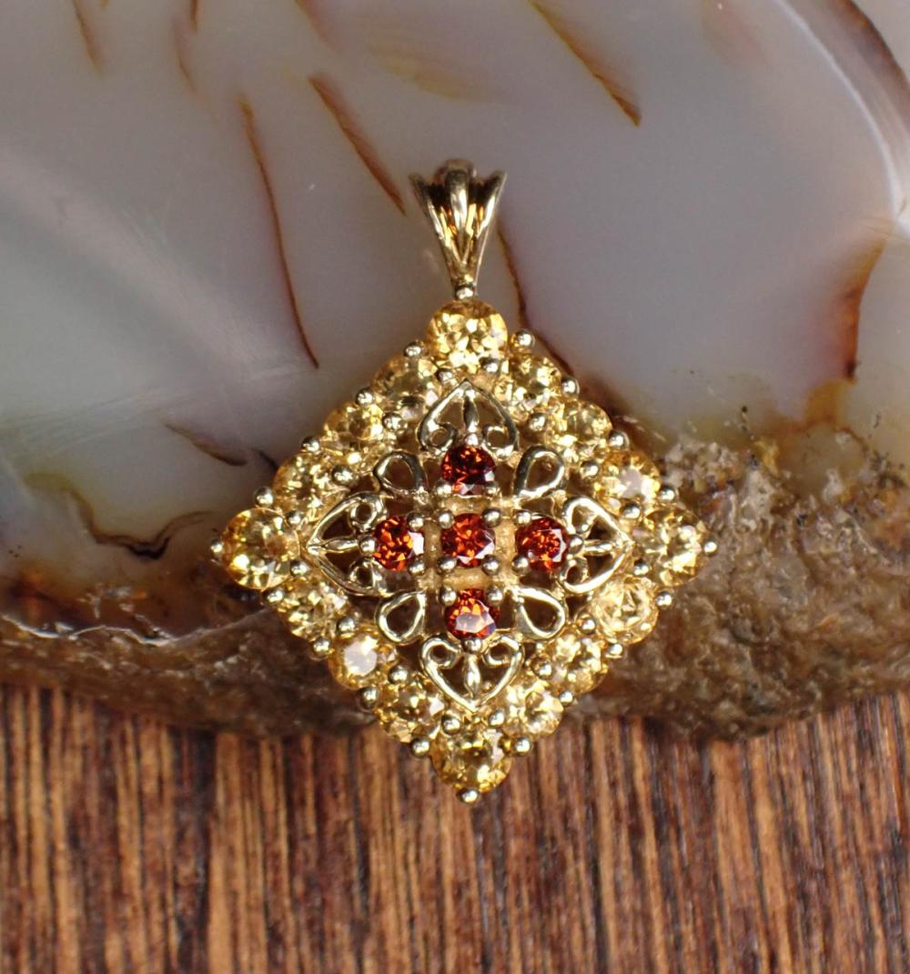 Appraisal: CITRINE GARNET AND YELLOW GOLD PENDANT The k gold pendant