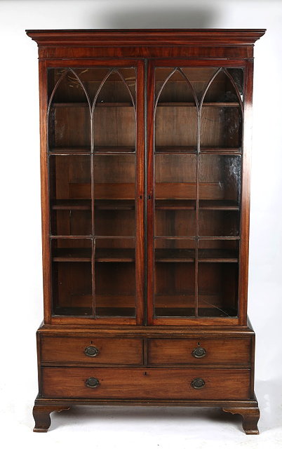 Appraisal: A TH CENTURY MAHOGANY BOOKCASE CONSTRUCTED IN TWO SECTIONS the