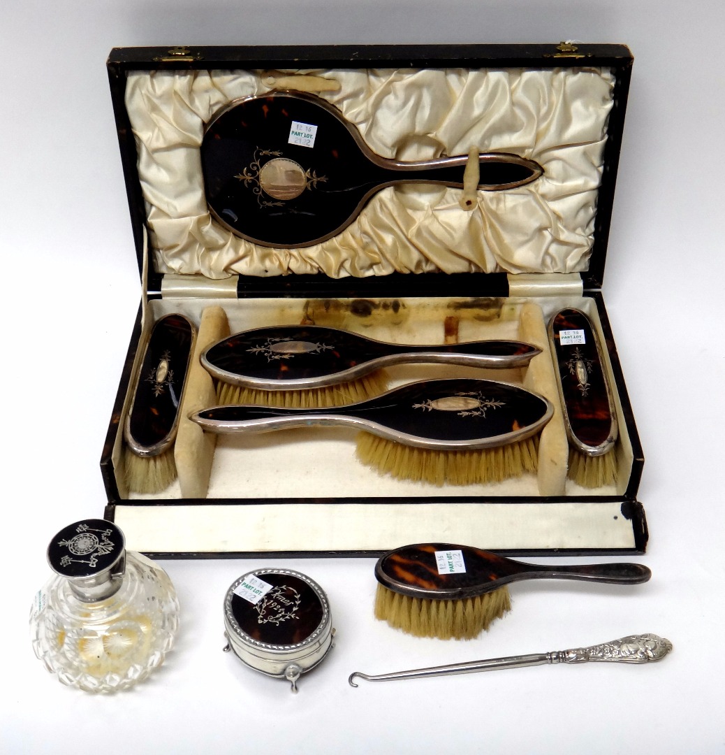 Appraisal: A silver and tortoiseshell mounted five piece lady's dressing set